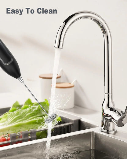 Kitchen faucet with water flowing into a sink, featuring text 'Easy To Clean'.